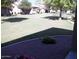 Landscaped backyard with grassy area and gravel at 9612 E Champagne Dr, Sun Lakes, AZ 85248