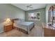 Bedroom with ceiling fan and dresser with mirror at 9612 E Champagne Dr, Sun Lakes, AZ 85248