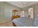 Bedroom with ceiling fan and ensuite bathroom access at 9612 E Champagne Dr, Sun Lakes, AZ 85248