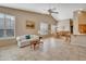 Open concept living and dining area with tile floors at 9612 E Champagne Dr, Sun Lakes, AZ 85248