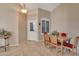 Bright dining area with a wooden table and red chairs at 9612 E Champagne Dr, Sun Lakes, AZ 85248