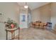 Entryway with tile floor, a wooden table, and a dining area at 9612 E Champagne Dr, Sun Lakes, AZ 85248