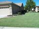 Well-maintained home exterior with green lawn at 9612 E Champagne Dr, Sun Lakes, AZ 85248