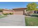 Two-car garage with a neutral-colored door and driveway at 9612 E Champagne Dr, Sun Lakes, AZ 85248