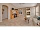 Gathering room with tiled floors, wood cabinet, and patio access at 9612 E Champagne Dr, Sun Lakes, AZ 85248