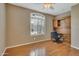 Home office with wood desk and built-in shelving at 9612 E Champagne Dr, Sun Lakes, AZ 85248
