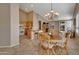 Bright kitchen with light wood cabinets, tile floor, and an island at 9612 E Champagne Dr, Sun Lakes, AZ 85248