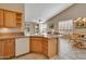 Kitchen with island, stainless steel appliances, and view to backyard at 9612 E Champagne Dr, Sun Lakes, AZ 85248