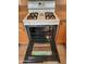 Clean oven with four burners at 9612 E Champagne Dr, Sun Lakes, AZ 85248