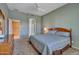 Primary bedroom with ceiling fan and ensuite bathroom access at 9612 E Champagne Dr, Sun Lakes, AZ 85248
