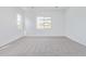 Spacious bedroom with neutral carpet, providing a bright and airy atmosphere at 11946 W Parkway Ln, Avondale, AZ 85323