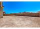 This is an image of an empty backyard surrounded by a block wall at 11949 W Parkway Ln, Avondale, AZ 85323