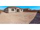 This is the backyard view of the home with no grass and a block wall at 11949 W Parkway Ln, Avondale, AZ 85323