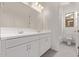 Bathroom featuring double sinks, large vanity mirror, and plenty of storage at 11949 W Parkway Ln, Avondale, AZ 85323