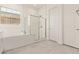 Bright bathroom with soaking tub and glass enclosed shower at 11949 W Parkway Ln, Avondale, AZ 85323
