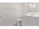 Bathroom with a modern vanity, a toilet, and a mirrored cabinet at 11949 W Parkway Ln, Avondale, AZ 85323