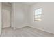 Cozy bedroom featuring neutral carpet, fresh paint, and a bright window at 11949 W Parkway Ln, Avondale, AZ 85323
