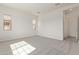 Spacious bedroom featuring two windows, neutral carpeting, and recessed lights at 11949 W Parkway Ln, Avondale, AZ 85323