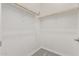 Walk-in closet featuring shelves for organization and rod for hanging clothes at 11949 W Parkway Ln, Avondale, AZ 85323