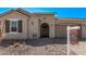 Inviting single-story home featuring a neutral stucco exterior, brown tile roof, and a well-maintained front yard at 11949 W Parkway Ln, Avondale, AZ 85323