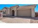 Beautiful home featuring a brick driveway and attached garage at 11949 W Parkway Ln, Avondale, AZ 85323