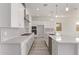 Spacious modern kitchen boasts stainless steel appliances, a quartz countertop, and plenty of cabinet space at 11949 W Parkway Ln, Avondale, AZ 85323