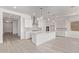 Light-filled open-concept kitchen and living area showcasing modern finishes and an easy flow at 11949 W Parkway Ln, Avondale, AZ 85323
