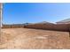 Spacious backyard is enclosed with a brick fence, perfect for creating a relaxing and private outdoor retreat at 12003 W Parkway Ln, Avondale, AZ 85323