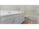 Bright bathroom with a double sink vanity, shower, and tiled bathtub at 12003 W Parkway Ln, Avondale, AZ 85323