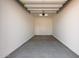 Spacious garage with overhead lighting and large concrete floor at 12003 W Parkway Ln, Avondale, AZ 85323