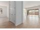 Hallway with tile flooring and view to living room and sliding glass doors at 12003 W Parkway Ln, Avondale, AZ 85323
