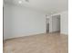 Spacious living area with wood-look flooring and neutral walls, creating a blank canvas at 12003 W Parkway Ln, Avondale, AZ 85323
