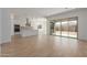 Open-concept living area boasts ample natural light and modern wood-look flooring at 12003 W Parkway Ln, Avondale, AZ 85323