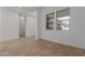 Neutral living area offering wood-look floors and ample natural light through well-placed windows at 12003 W Parkway Ln, Avondale, AZ 85323