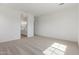 Spacious main bedroom featuring neutral carpet and an ensuite bathroom at 12003 W Parkway Ln, Avondale, AZ 85323