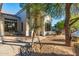 Inviting front yard with desert landscaping and a charming facade bathed in sunlight at 3060 N Ridgecrest -- # 56, Mesa, AZ 85207