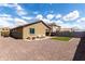 A backyard featuring gravel landscaping, a patch of artificial turf, and outdoor seating at 18147 W Ida Ln, Surprise, AZ 85387