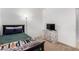 Bedroom features a ceiling fan, flat screen television and decorative night stand at 18147 W Ida Ln, Surprise, AZ 85387