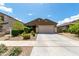 Charming single-story home with low-maintenance front yard landscaping and a two-car garage at 18147 W Ida Ln, Surprise, AZ 85387