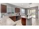 Bright kitchen with stainless steel appliances, a center island, and sliding doors to outdoor dining at 18147 W Ida Ln, Surprise, AZ 85387