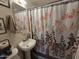 Clean bathroom with pedestal sink and shower/tub combo at 206 N 5Th St, Avondale, AZ 85323
