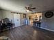Open living room with kitchen view, wood-look floors, and barn door at 206 N 5Th St, Avondale, AZ 85323
