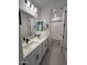 Contemporary bathroom with dual sinks, modern fixtures, and a separate toilet area at 10262 W Columbus Ave, Avondale, AZ 85392