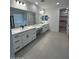 Bright, modern bathroom featuring double sinks, spacious vanity, and ample storage at 10262 W Columbus Ave, Avondale, AZ 85392