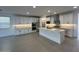 Open-concept kitchen featuring stainless steel appliances, a large island, and stylish finishes at 10262 W Columbus Ave, Avondale, AZ 85392