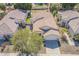 An aerial shot shows the house's roof, lawn, and surrounding neighborhood homes at 2223 E Branham Ln, Phoenix, AZ 85042