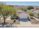 Charming home featuring a manicured front yard, a spacious two-car garage, and desert landscaping at 2223 E Branham Ln, Phoenix, AZ 85042