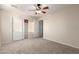 Bright bedroom with ceiling fan and closet at 1232 E Strawberry Dr, Gilbert, AZ 85298