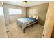 Bright bedroom with carpet flooring, closet, and a window bringing in natural light at 225 N Standage -- # 102, Mesa, AZ 85201