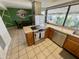 Open-concept kitchen with stainless steel appliances and a dining area with backyard view at 225 N Standage -- # 102, Mesa, AZ 85201